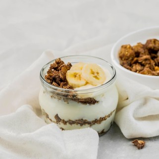 Close up delicious yogurt with granola banana