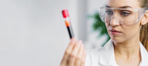 Portrait female researcher lab with test tube copy space