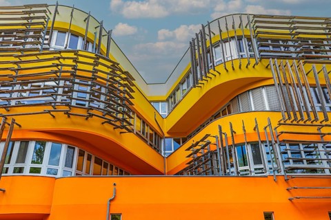 Modern building with pastel-coloured facade