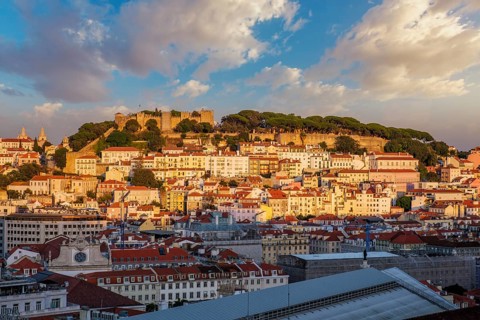 View of Lisbon city from Miradouro de Sao Pedro de Alcantara viewpoint on sunset. Lisbon