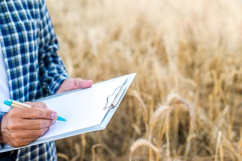 Man taking notes clipboard