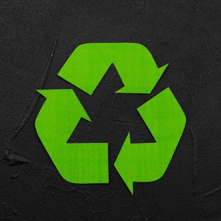 Recycle logo black plaster background