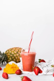 Cup delicious strawberry smoothie