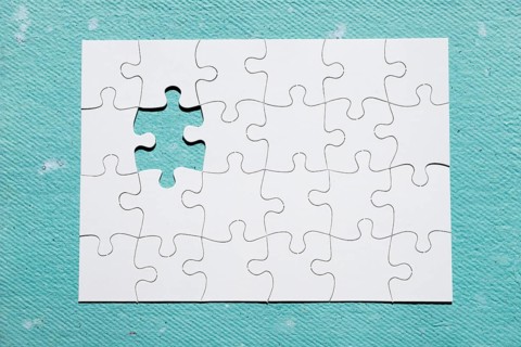 Missing piece puzzle blue textured backdrop
