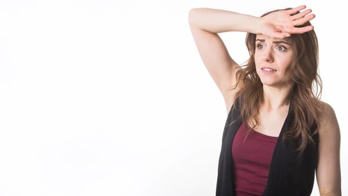 Worried young woman white background