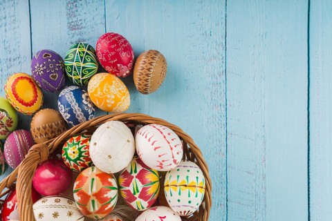 Colored eggs wicker basket