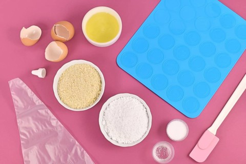 Ingredients for making homemade French Macaron sweets including powdered sugar