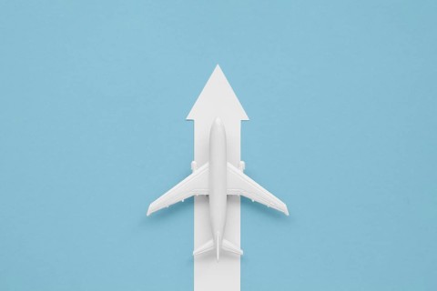 Flat lay arrow airplane direction