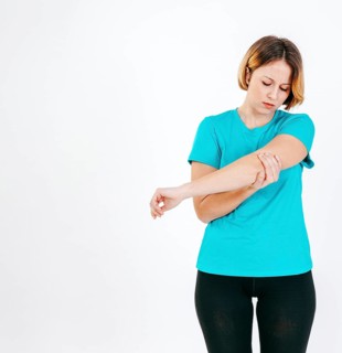 Pretty woman with hurting elbow