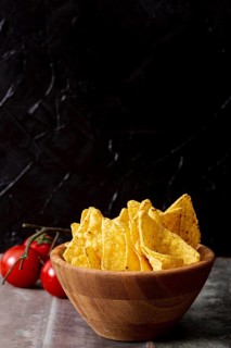 Tasty nachos wooden bowl tomatoes