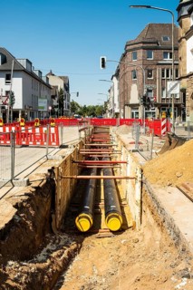 Construction work on a new district heating pipeline for the use of waste heat from an industrial plant in the Benrath district