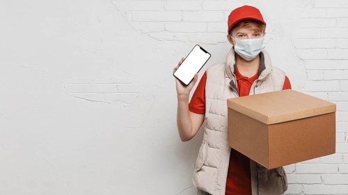 Medium shot guy holding box phone