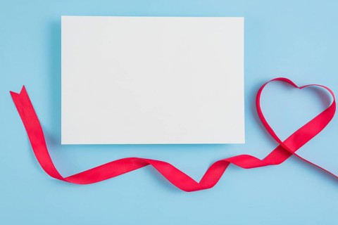 Paper near symbol heart ribbon
