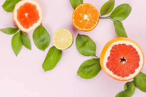 Slices fresh exotic fruits green foliage