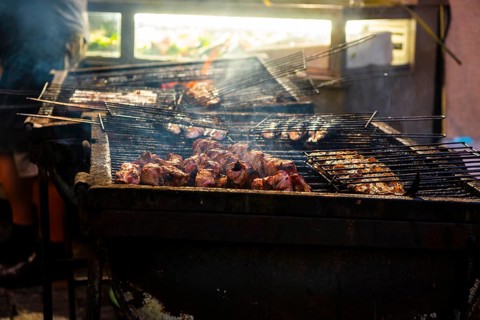 Fish and meat on a grill of a restaurant in the old town of Lisbon
