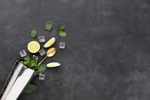 Top view cocktail essentials with mint shaker