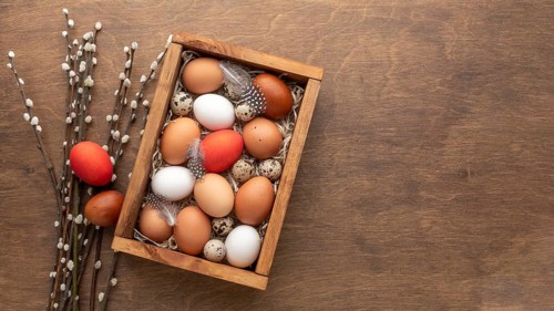 Flat lay box with eggs easter copy space