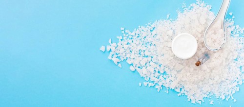 Minimalist bath salt spa concept spoon