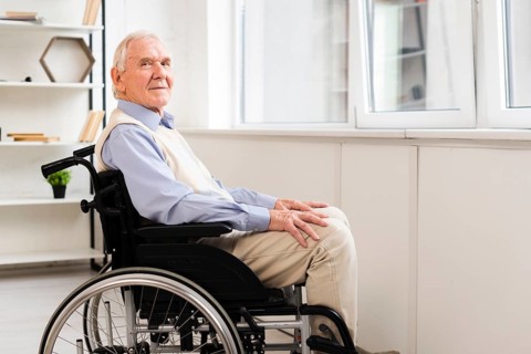 Side view elder sitting wheelchair