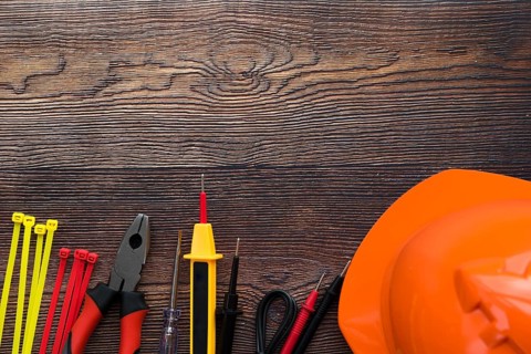Top view electric equipment wooden background