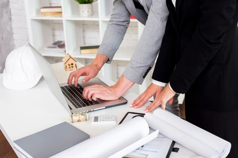 Sales agent using laptop