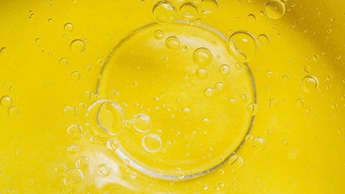 Top view yellow liquid background