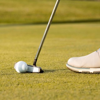 Man using club hit golf ball