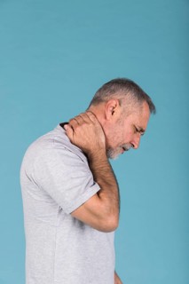 Side view mature man suffering from neck pain