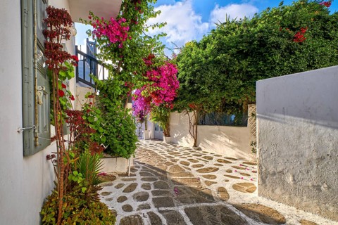 Romantic traditional narrow streets and beautiful walkways of Greek island towns. Whitewashed houses