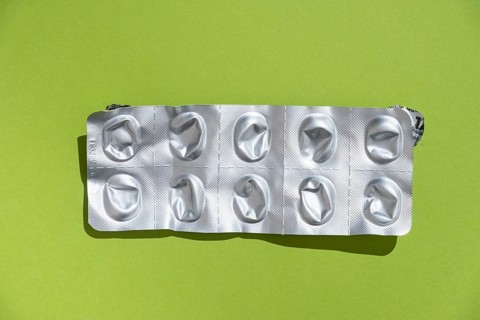 Empty tablet blister pack against a monochrome background