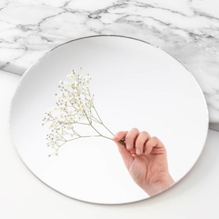 Hand with flowers mirror