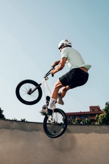 Young man extreme jumping with bicycle