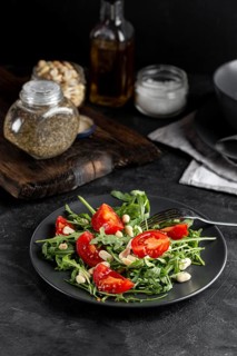 High view delicious salad dark plate