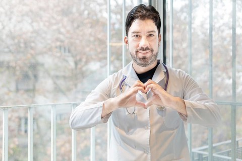 Latin cardiologist smiling at the camera