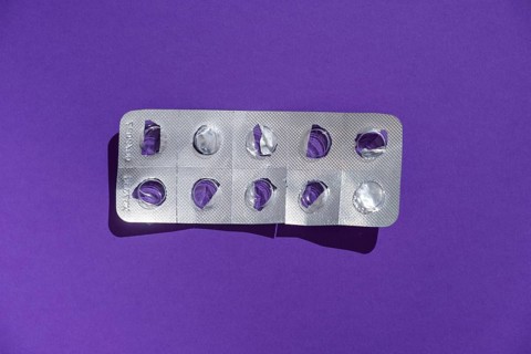 Empty tablet blister pack against a monochrome background