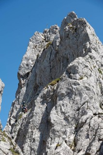 Climber abseiling on the Rossstein Needle