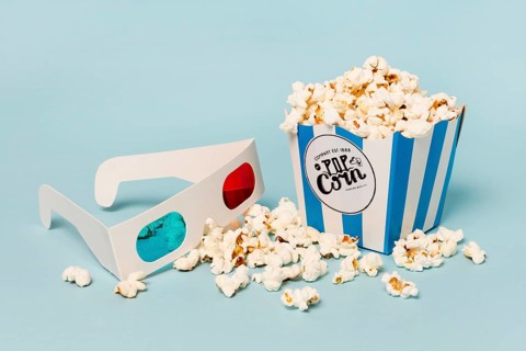 3d glasses with popcorns box blue backdrop