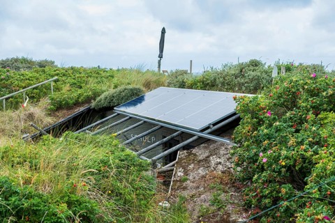 Solar panel above a former bunker of the German Wehrmacht on the North Sea island of Terschelling