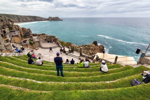 Grass-covered audience seats at The Minack Theatre
