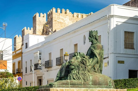 The monument to King Sancho IV El Bravo in front of Guzman Castle in Tarifa