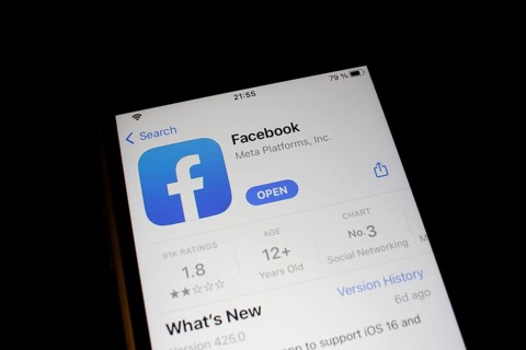 Detailed view of a smartphone with Facebook app in the iPhone App Store