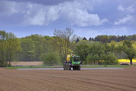 Farmer spraying pesticides