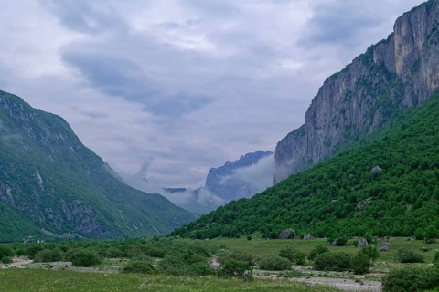 Komarnica Valley in the Dragisnica and Komarnica nature park Park with the mountains of the Durmitor massif and the Dinarides mountain range. Komarnica