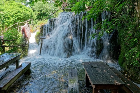Waterfall at the old mill Kristijan on the Krka stream in the Krka National Park in Northern Dalmatia. Sibenik-Knin