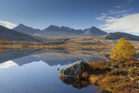 Digerronden reflected in water of lake in autumn