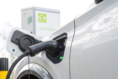 A car being charged at a public charging station