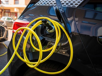 An e-car charges at a public charging station in Duesseldorf