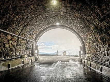 Photo with reduced dynamic saturation HDR of mountain pass alpine mountain road alpine road pass road pass view from tunnel Hochtor of Grossglockner High Alpine Road Grossglockner High Alpine Road in ...