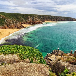 View from Minack Theatre of rocky coast with Pedn Vounder Beach and Porthcurno Beach