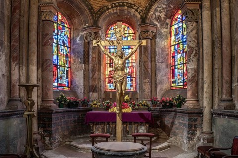 Crucifix in the interior of a chapel of the church Saint-Nicolas